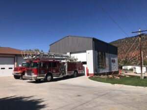 Photo of newly constructed fire engine bay addition built by PNCI construction with fire trucks parked in front