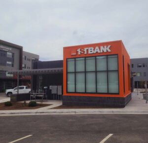 Exterior photo of newly constructed 1st Bank building in Basalt, CO with brick veneer, ACM panels and prefinished corrugated metal