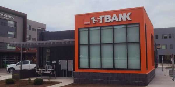 Exterior photo of newly constructed 1st Bank building in Basalt, CO with brick veneer, ACM panels and prefinished corrugated metal