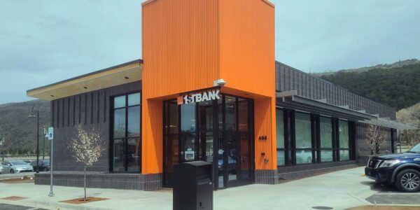 Exterior photo of newly constructed 1st Bank building in Basalt, CO showcasing distinctive custom orange entryway