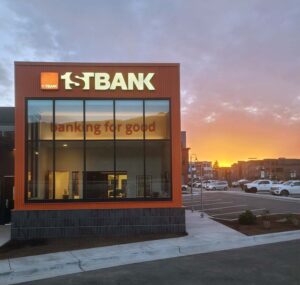 Photo of newly constructed 1st Bank building in Basalt, CO at sunset highlighting custom brick veneer and distinctive orange siding